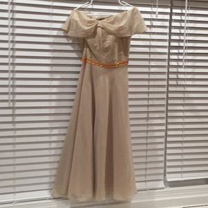 Off chiffon shoulder formal dress in tan.